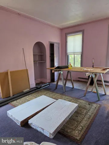 a living room with a rug