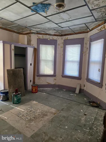 a room with gym equipment and a table