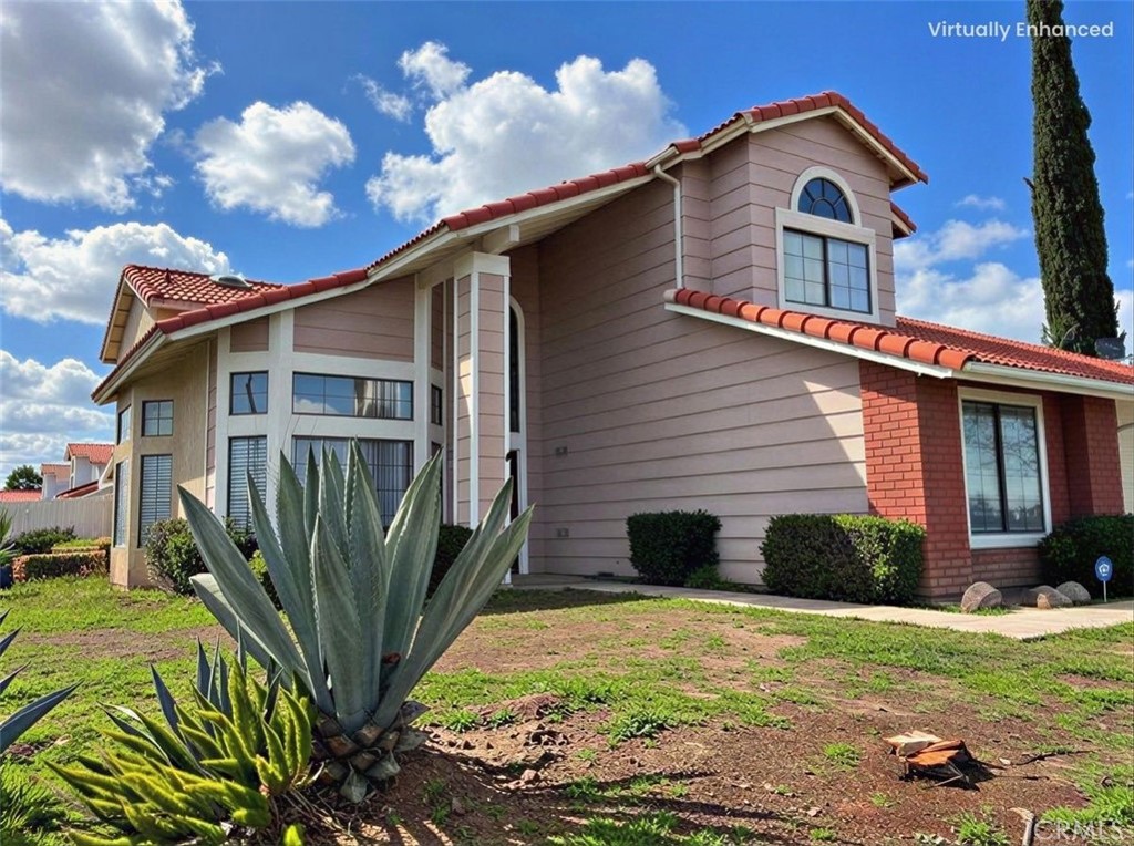 a front view of a house with garden