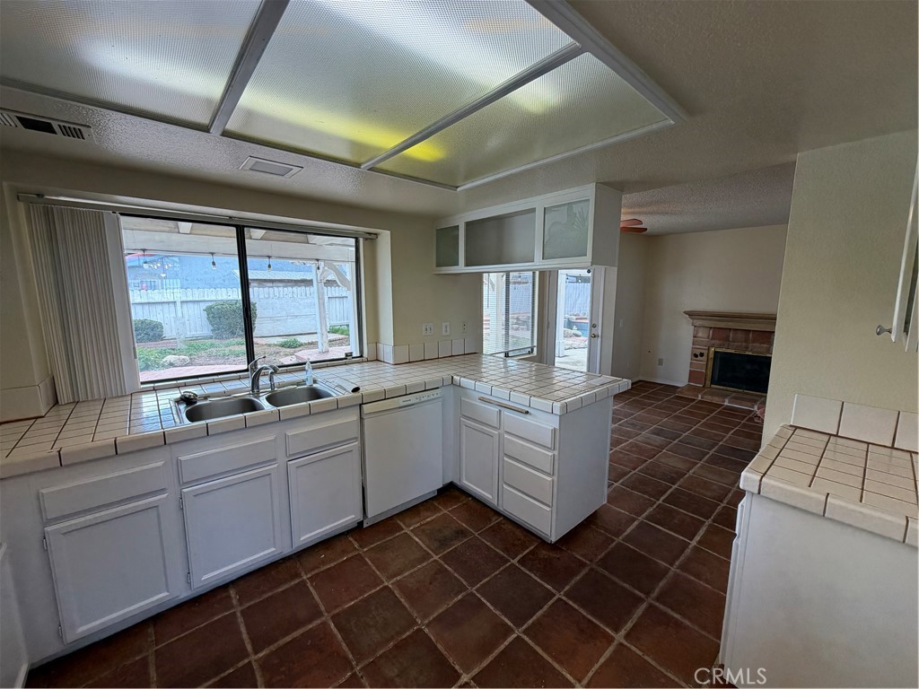 2560 East Ave R12 Palmdale, CA 93550 - Photo 11 of 26 a room with white cabinets and sink