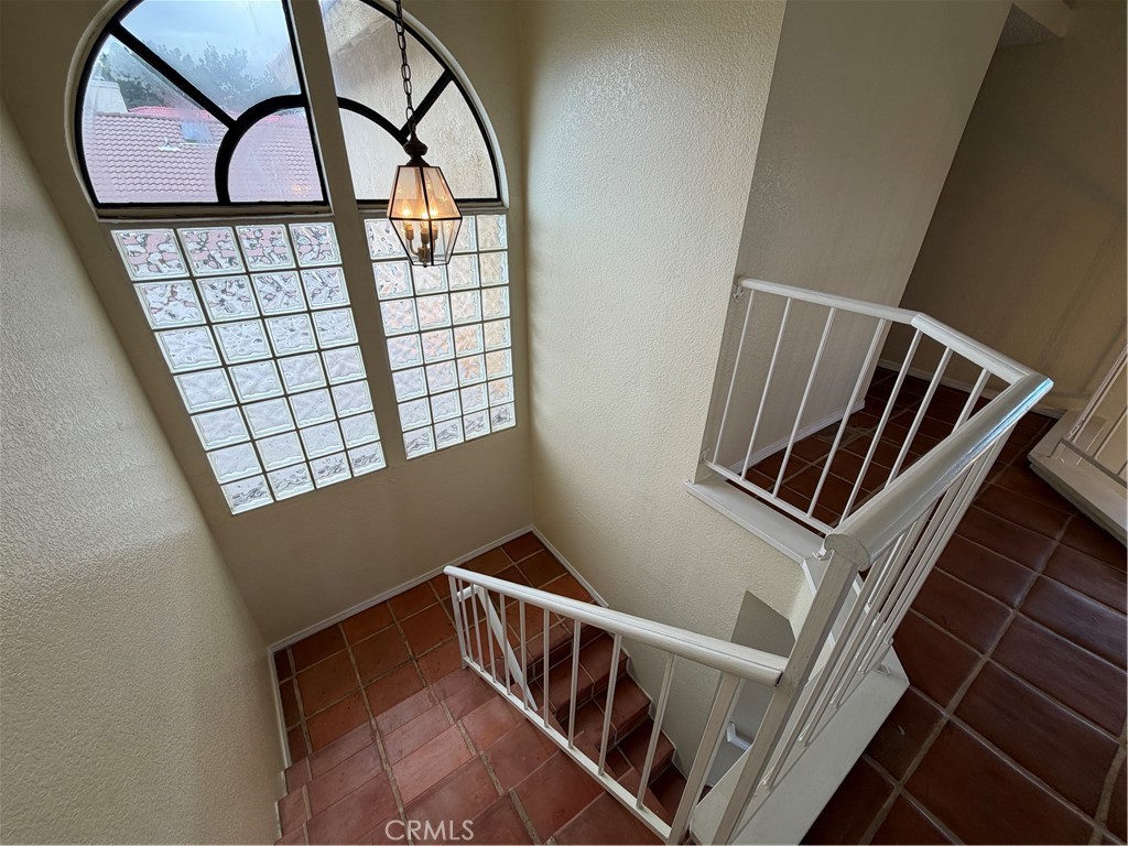 2560 East Ave R12 Palmdale, CA 93550 - Photo 14 of 26 a view of staircase with a rug