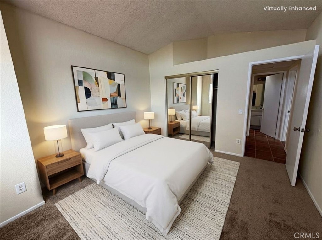 2560 East Ave R12 Palmdale, CA 93550 - Photo 16 of 26 a bedroom with bed and cupboard