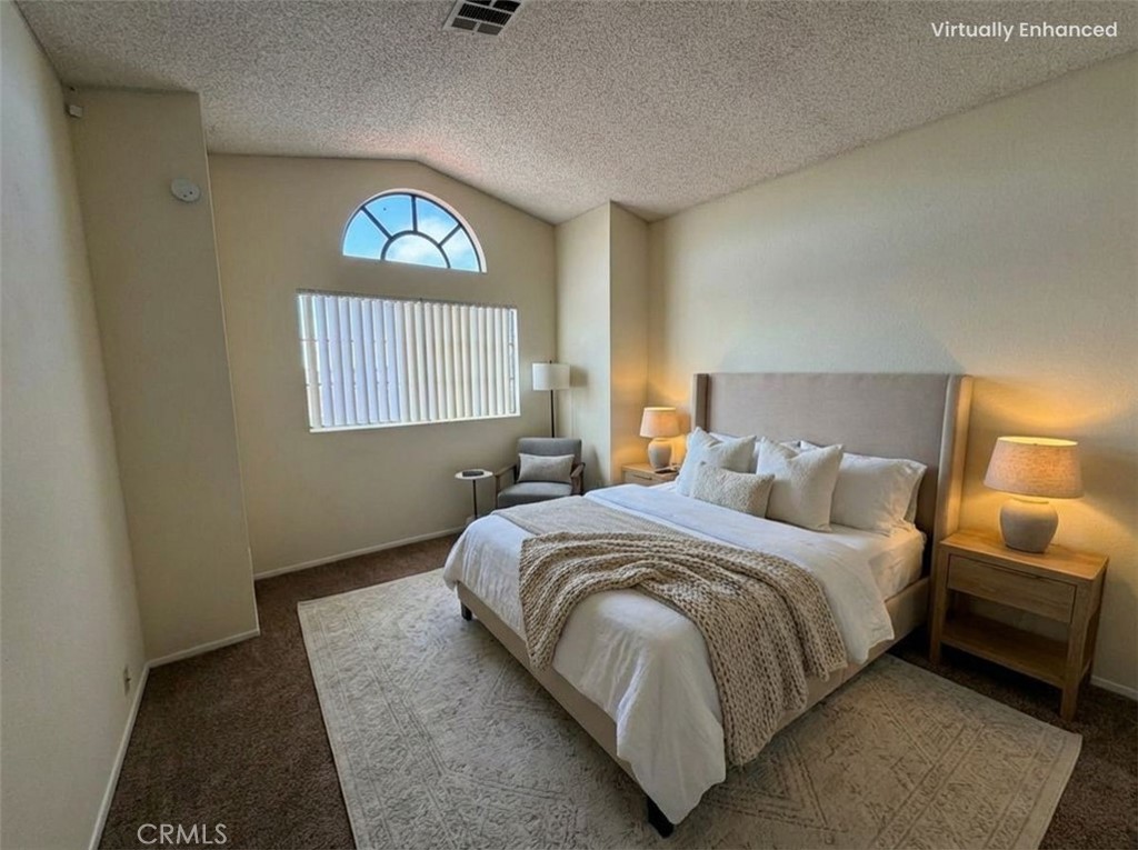 2560 East Ave R12 Palmdale, CA 93550 - Photo 18 of 26 a bedroom with a bed and a window