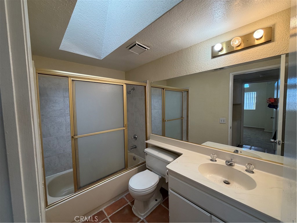 2560 East Ave R12 Palmdale, CA 93550 - Photo 19 of 26 a bathroom with a sink toilet and shower