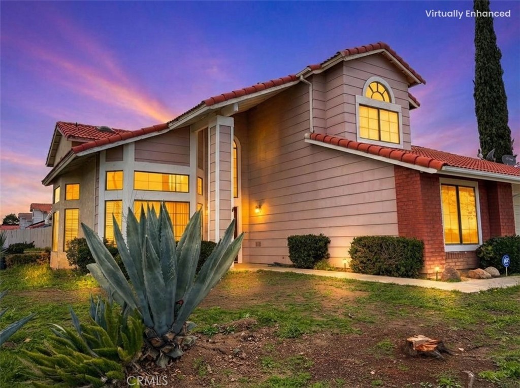 2560 East Ave R12 Palmdale, CA 93550 - Photo 2 of 26 a front view of a house with garden
