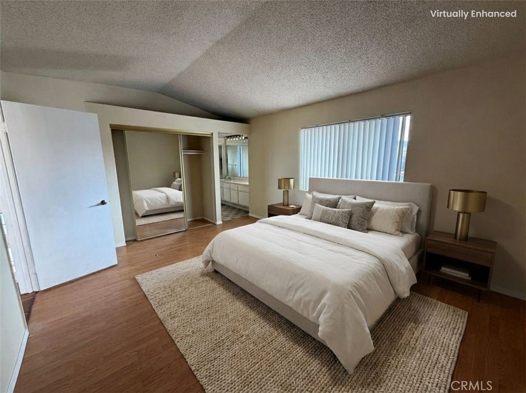 2560 East Ave R12 Palmdale, CA 93550 - Photo 21 of 26 a bedroom with bed and window