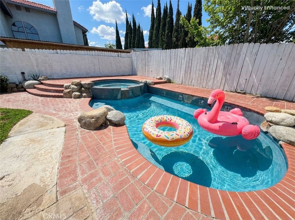 2560 East Ave R12 Palmdale, CA 93550 - Photo 26 of 26 a view of a backyard with table and chairs