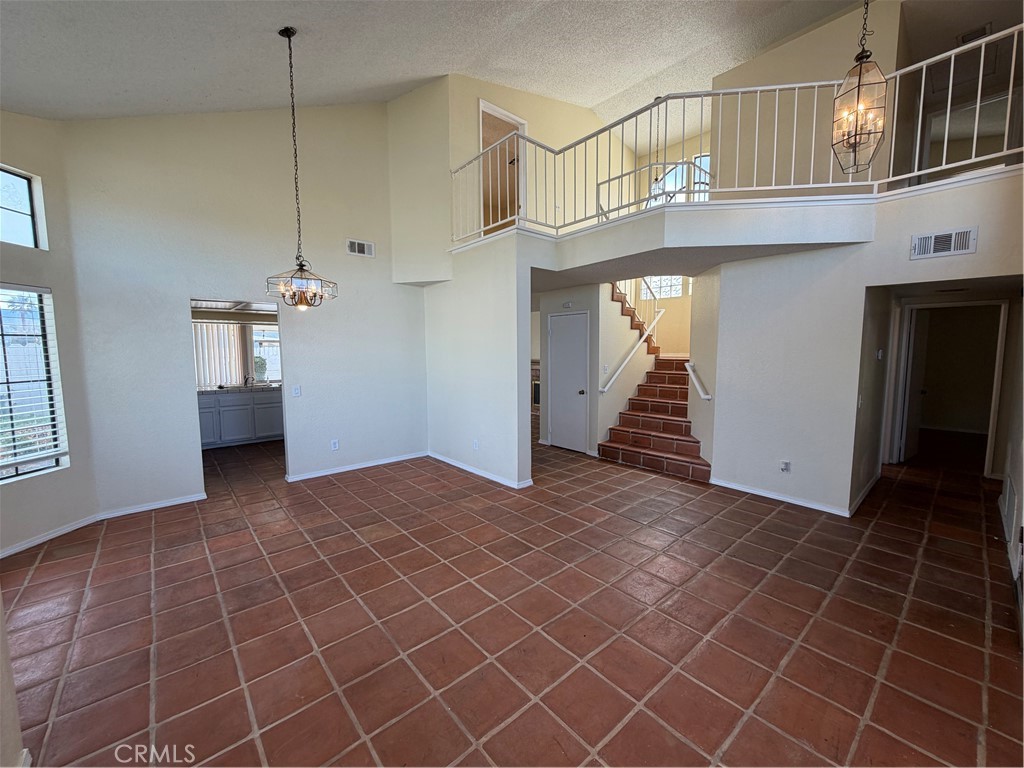 2560 East Ave R12 Palmdale, CA 93550 - Photo 3 of 26 a view of an entryway with staircase