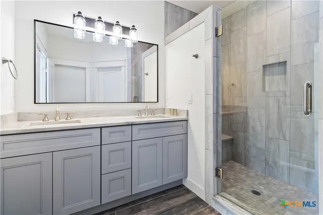 a bed room with a bed and a painting on the wall