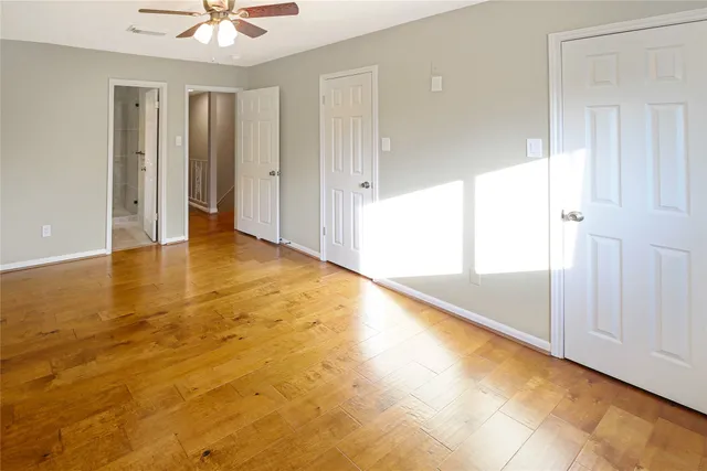 a bathroom with a toilet sink and shower