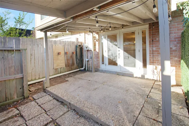 a view of an empty room with wooden walls