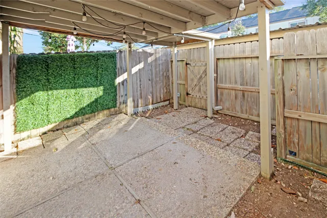 a view of a swimming pool with a patio
