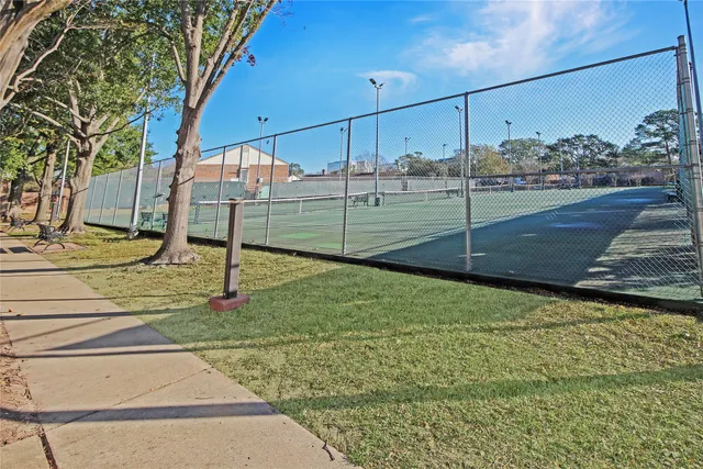 a view of a swimming pool with an outdoor space and seating area