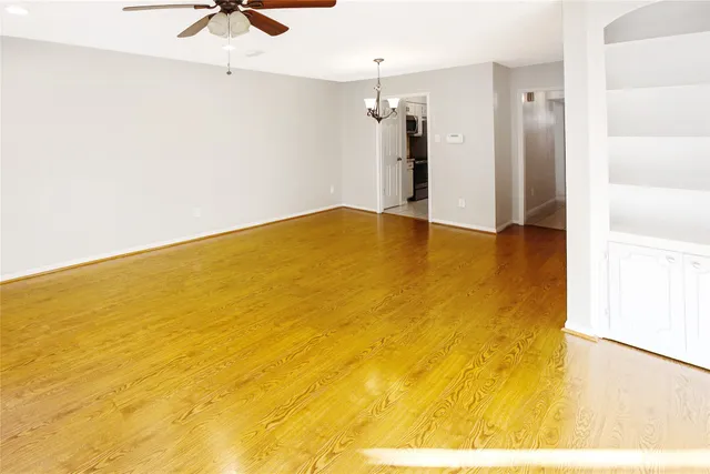 a view of staircase with white walls and railing