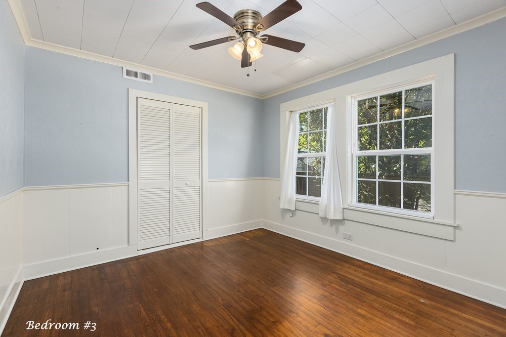 421 House Street Lufkin, TX 75904 - Photo 22 of 46 an empty room with wooden floor and windows