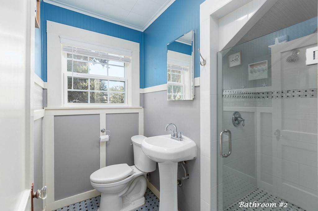 421 House Street Lufkin, TX 75904 - Photo 23 of 46 a bathroom with a sink toilet and a mirror