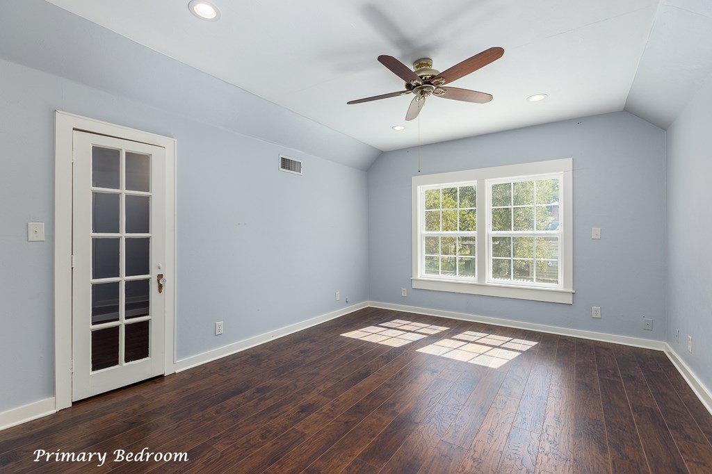 421 House Street Lufkin, TX 75904 - Photo 29 of 46 an empty room with wooden floor fan and windows