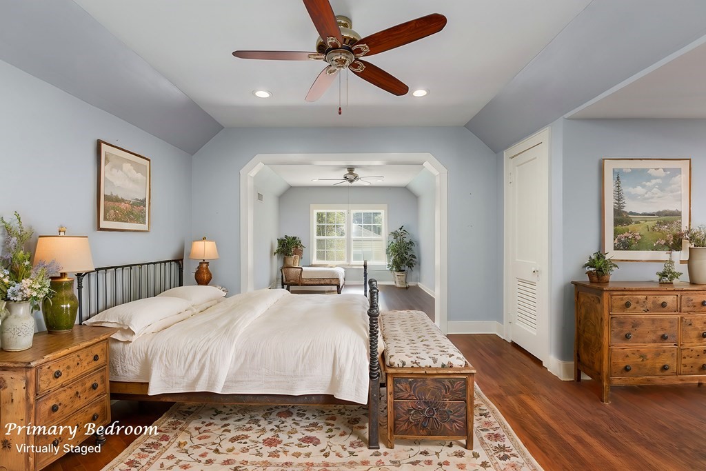 421 House Street Lufkin, TX 75904 - Photo 7 of 46 a bedroom with a bed a chandelier and dresser