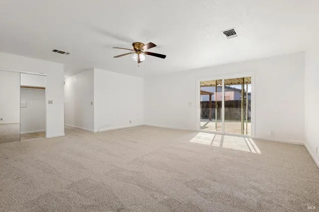 a view of empty room with windows