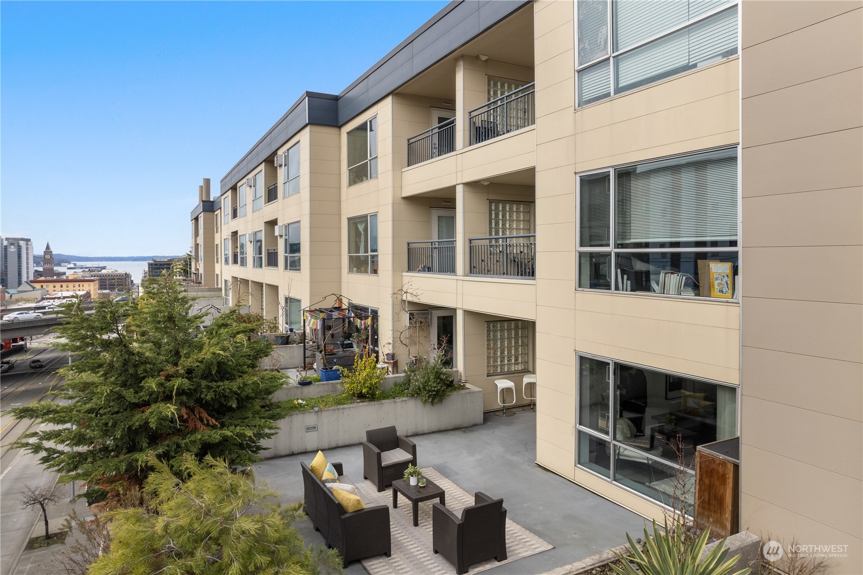 321 10th Avenue South, Unit 508 Seattle, WA 98104 - Photo 1 of 26 a building outdoor space with patio furniture and potted plants