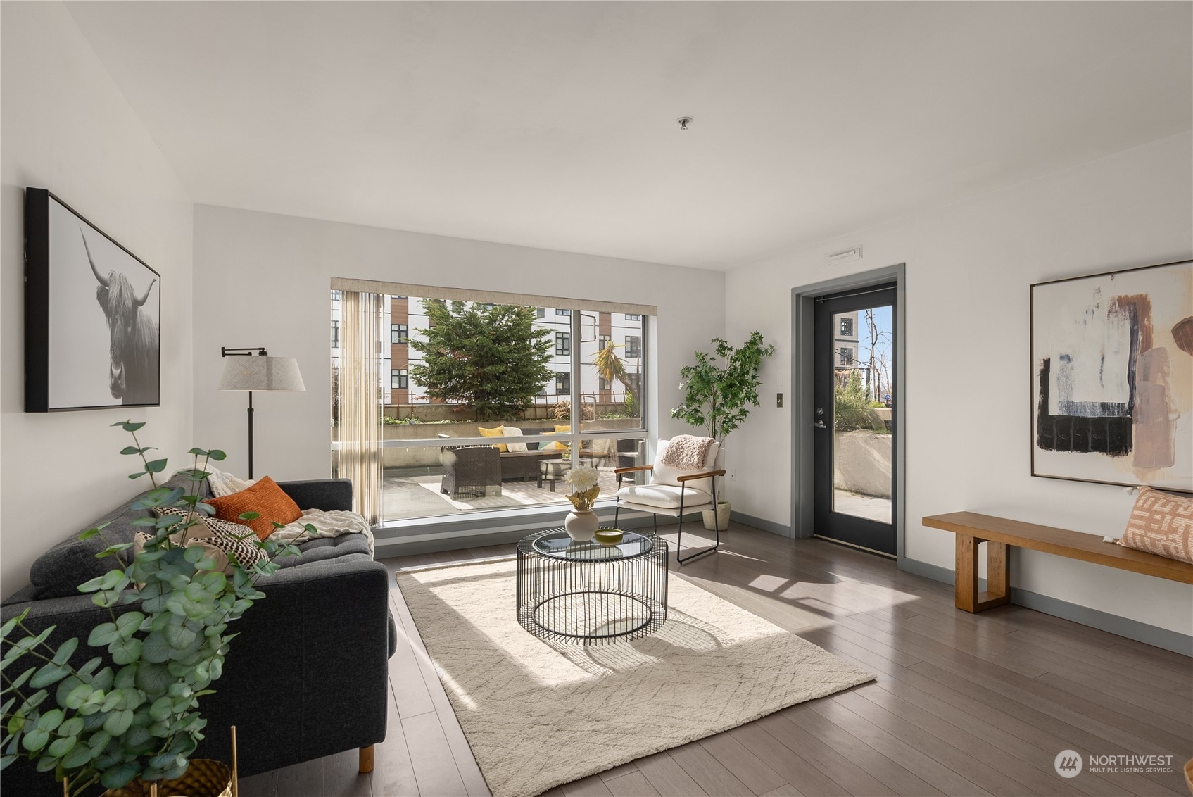 321 10th Avenue South, Unit 508 Seattle, WA 98104 - Photo 12 of 26 a living room with furniture and a large window