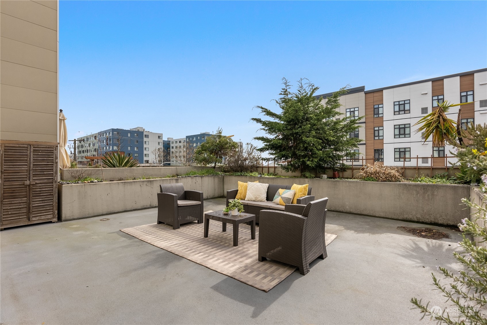 321 10th Avenue South, Unit 508 Seattle, WA 98104 - Photo 13 of 26 a terrace of a building with outdoor seating and a terrace