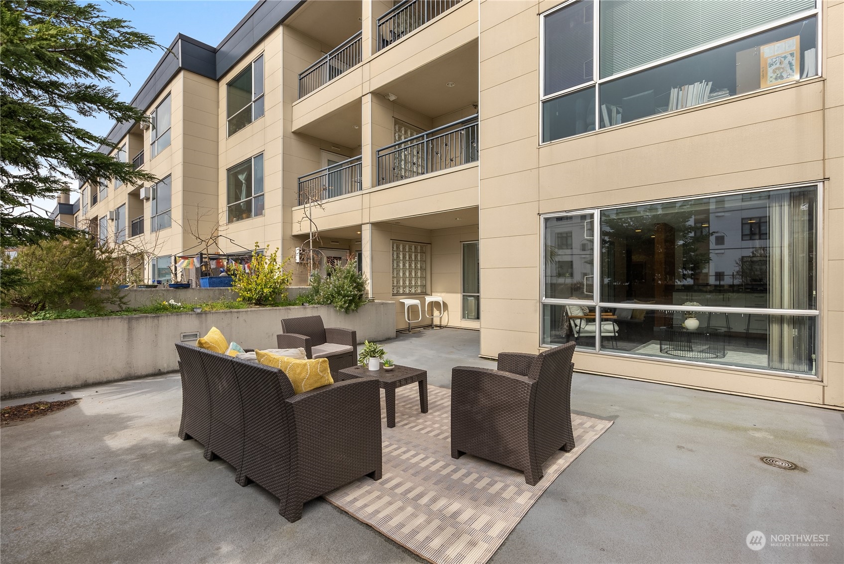 321 10th Avenue South, Unit 508 Seattle, WA 98104 - Photo 14 of 26 a outdoor living space with furniture and a potted plant