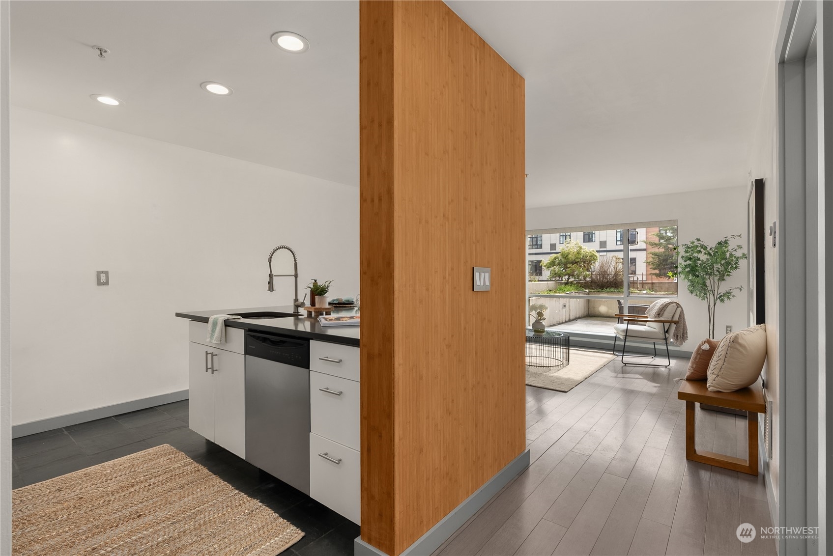321 10th Avenue South, Unit 508 Seattle, WA 98104 - Photo 3 of 26 a kitchen with a sink appliances and wooden floor