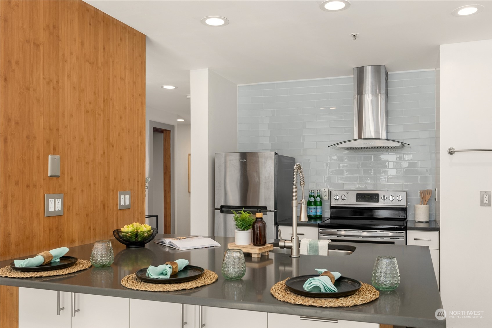 321 10th Avenue South, Unit 508 Seattle, WA 98104 - Photo 8 of 26 a kitchen with a table and chairs in it