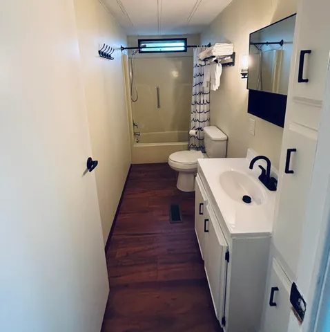 a bathroom with a double vanity sink and mirror