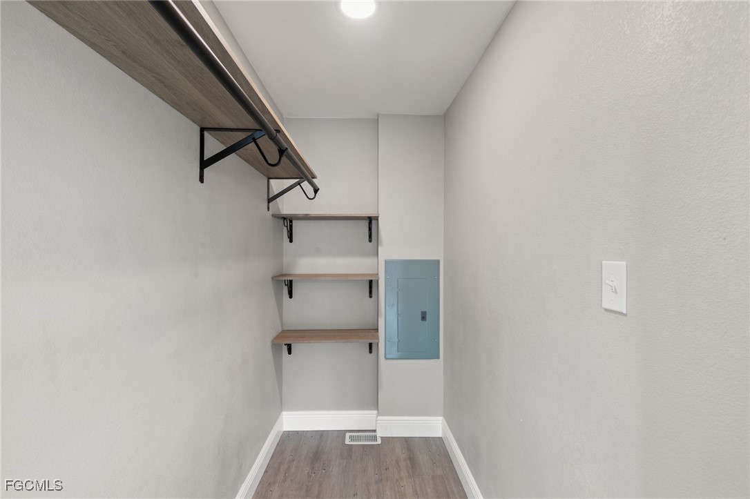 57 San Remo Circle Naples, FL 34112 - Photo 20 of 28 a view of wooden floor in a room