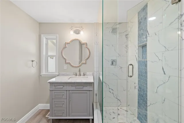 a view of outdoor space with seating area and trees in the background