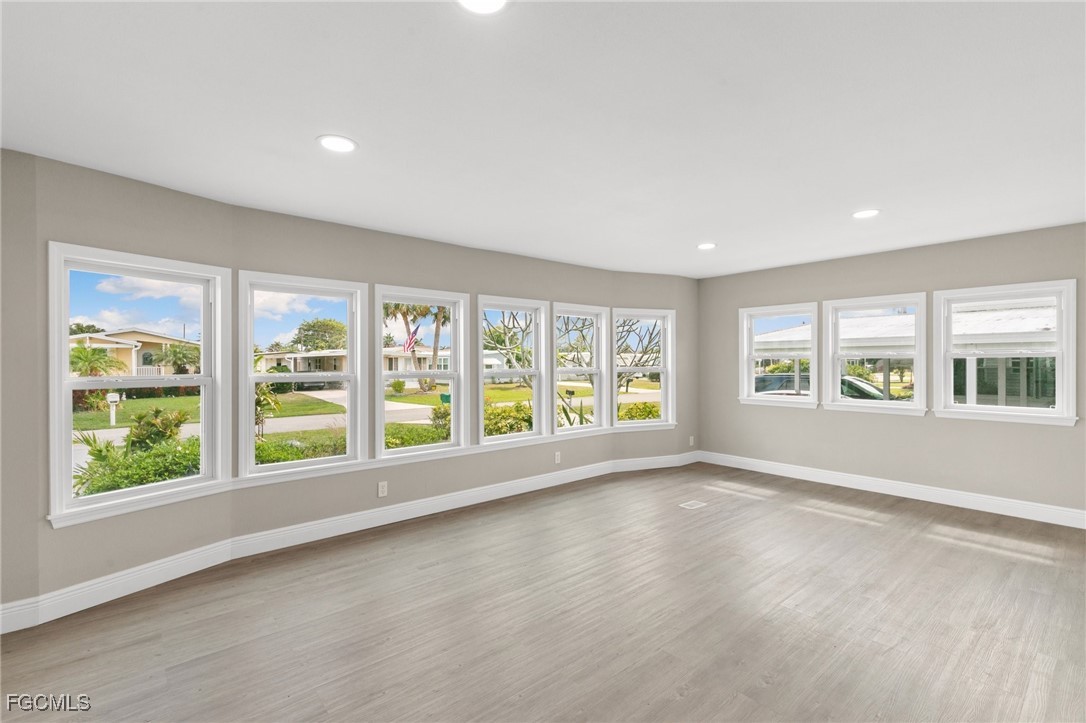 57 San Remo Circle Naples, FL 34112 - Photo 4 of 28 a view of an empty room with a window