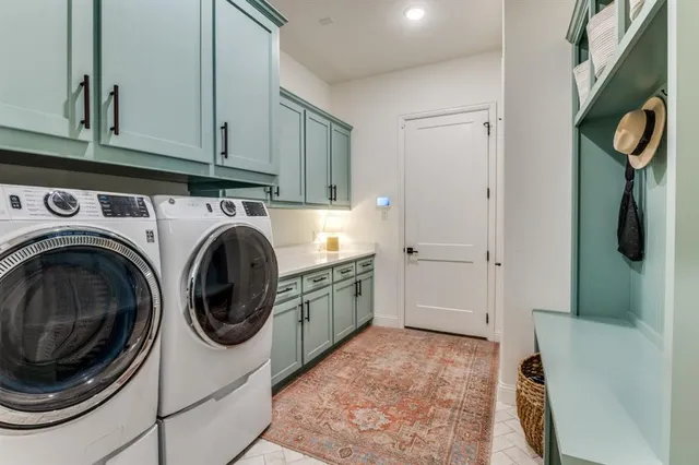 a view of a storage & utility room with washer and dryer