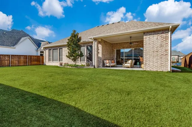 a view of a house with a yard porch and sitting area