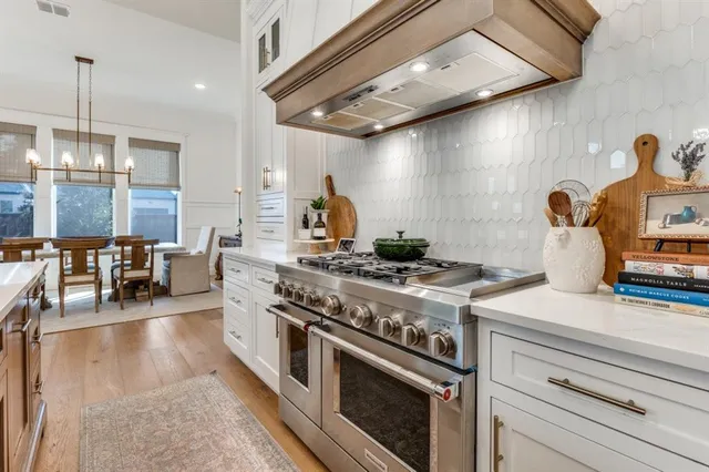 a kitchen with a stove and cabinets