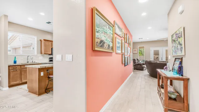 a hall with cabinets and wooden floor