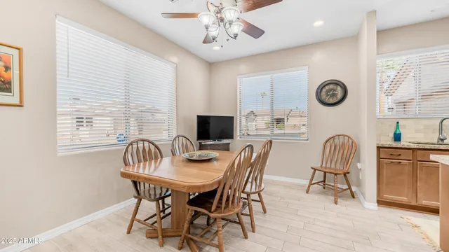 a dining room with furniture and window