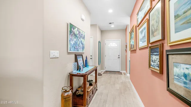 a view of an entryway with wooden floor