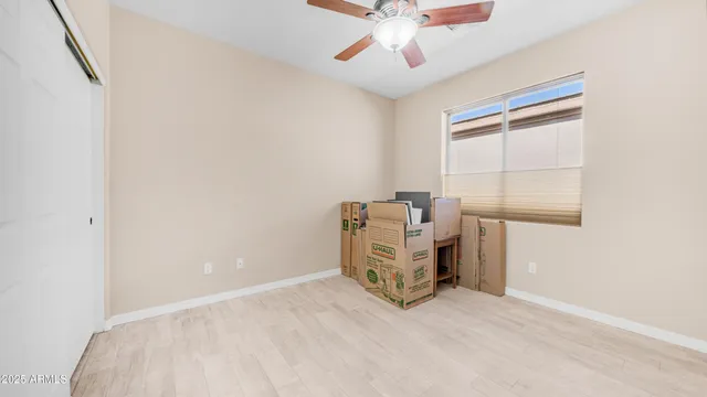 a view of a livingroom with furniture and a window