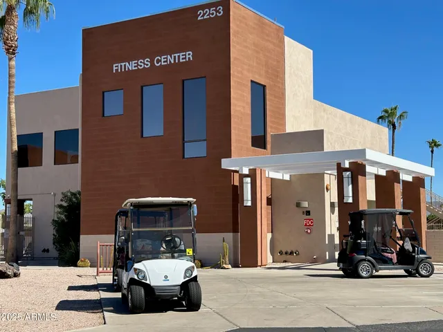 a swimming pool with outdoor seating