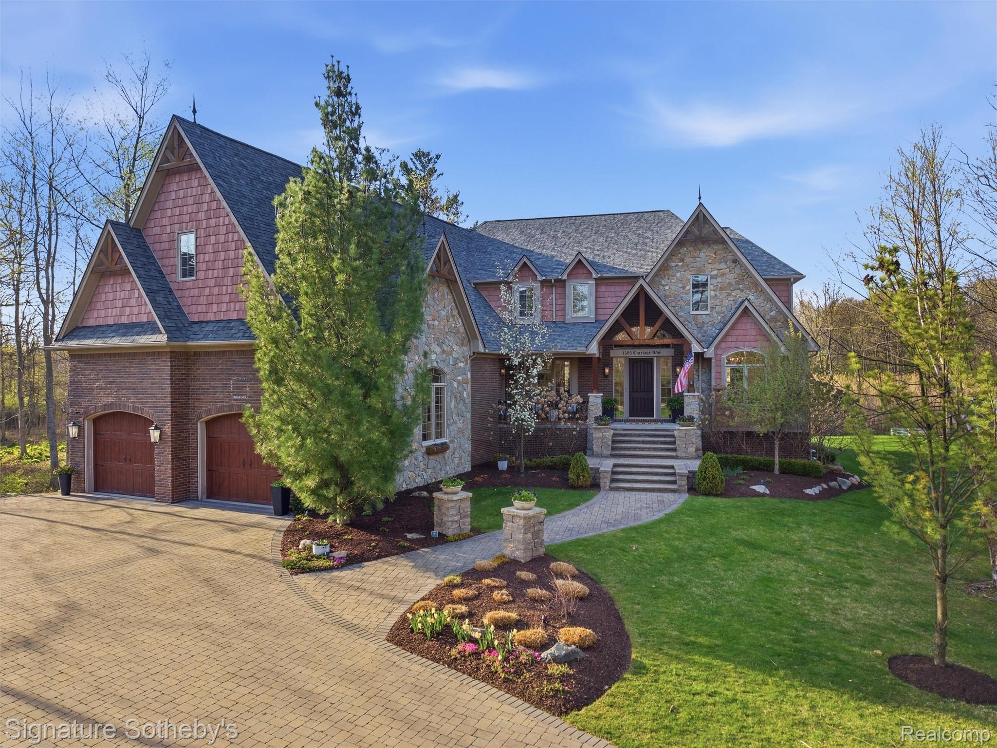 1595 Carriage Way Rochester, MI 48307 - Photo 6 of 78 Craftsman-style house with a porch, decorative driveway, a front lawn, and stone siding