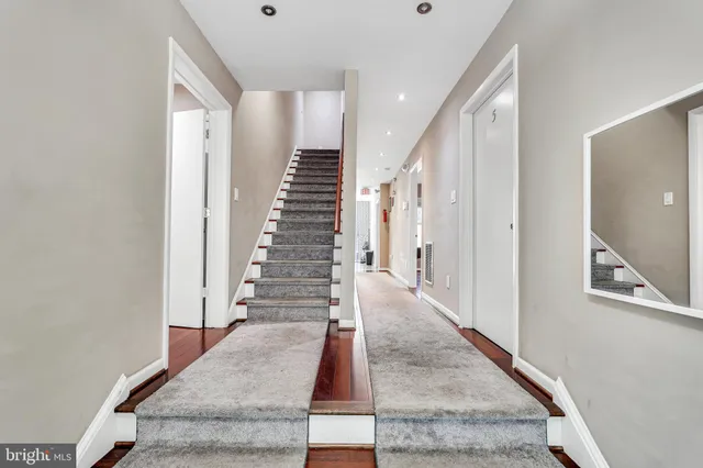a view of an entryway with wooden floor
