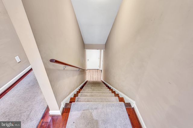 a white toilet sitting next to a bathroom sink and shower