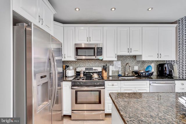 a view of storage and utility room with washer and dryer
