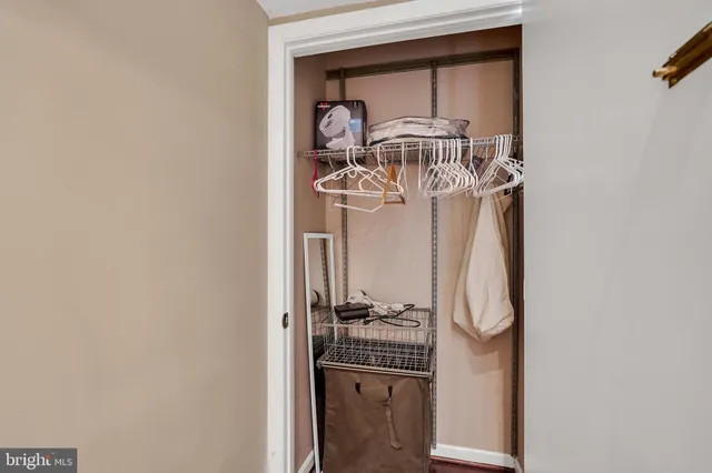 a bathroom with a sink a toilet a mirror and shower