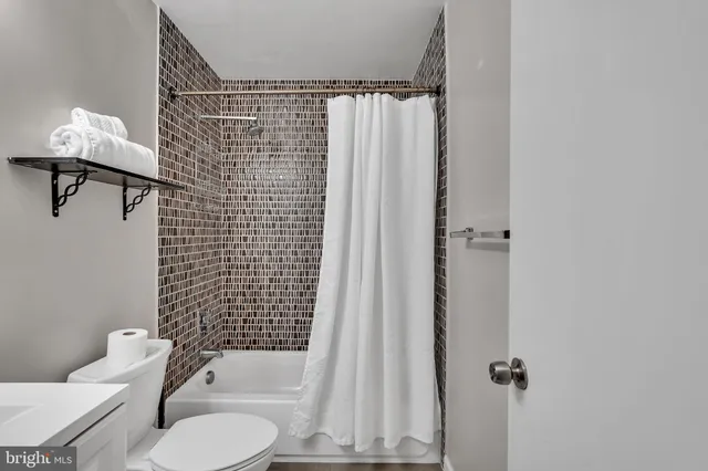 a bedroom with a bed and a table