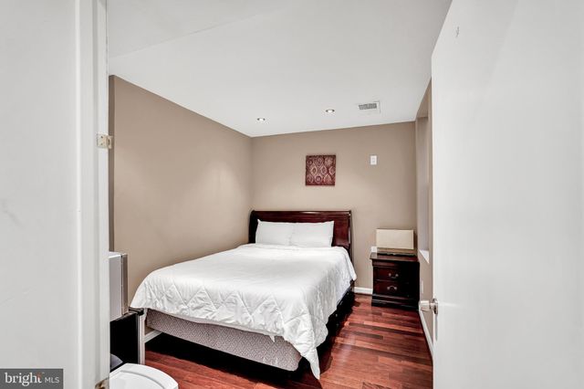 a bed room with a bed and a night stand