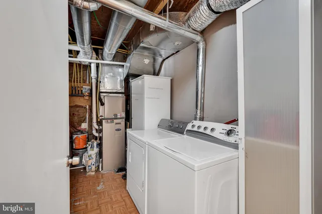 a bedroom with a bed and a television