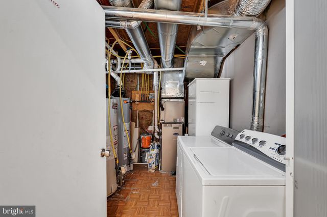a balcony view with a couple of chairs and a table
